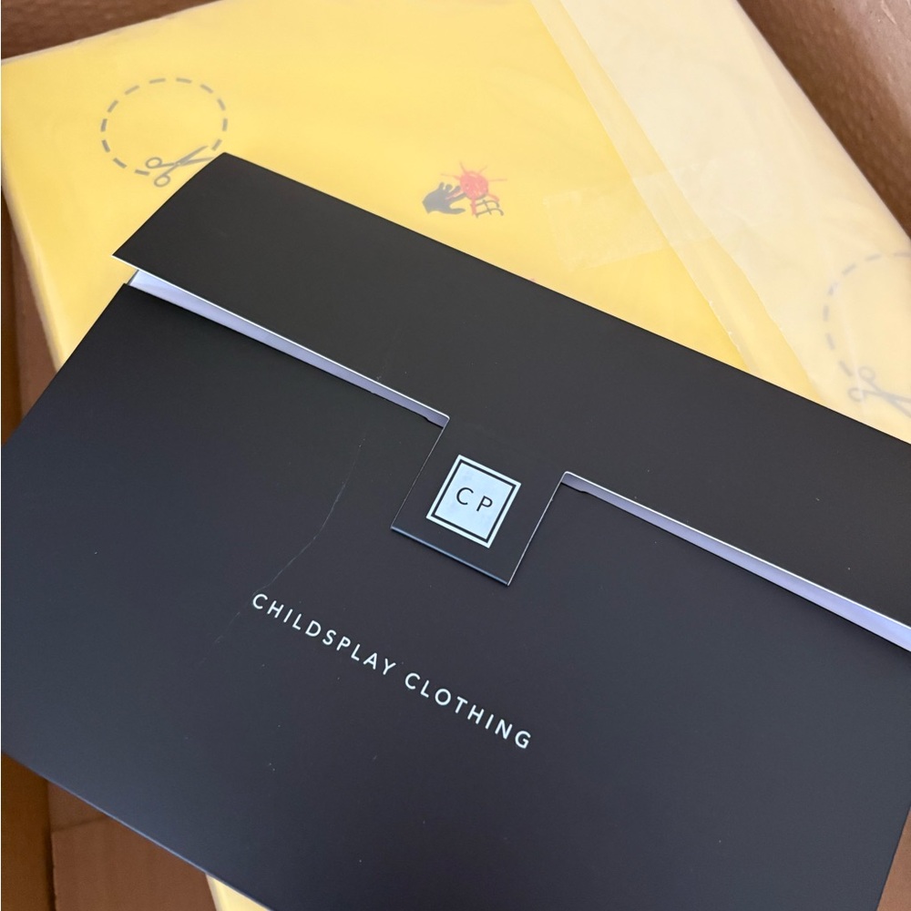 Childsplay Clothing Black and Yellow Packaging